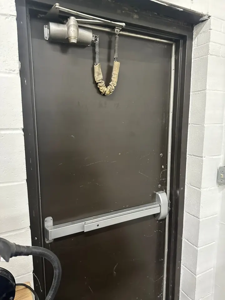 Commercial exit door with panic hardware and closer